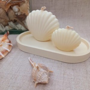 Velas em formato de concha, feitas artesanalmente em cera vegetal